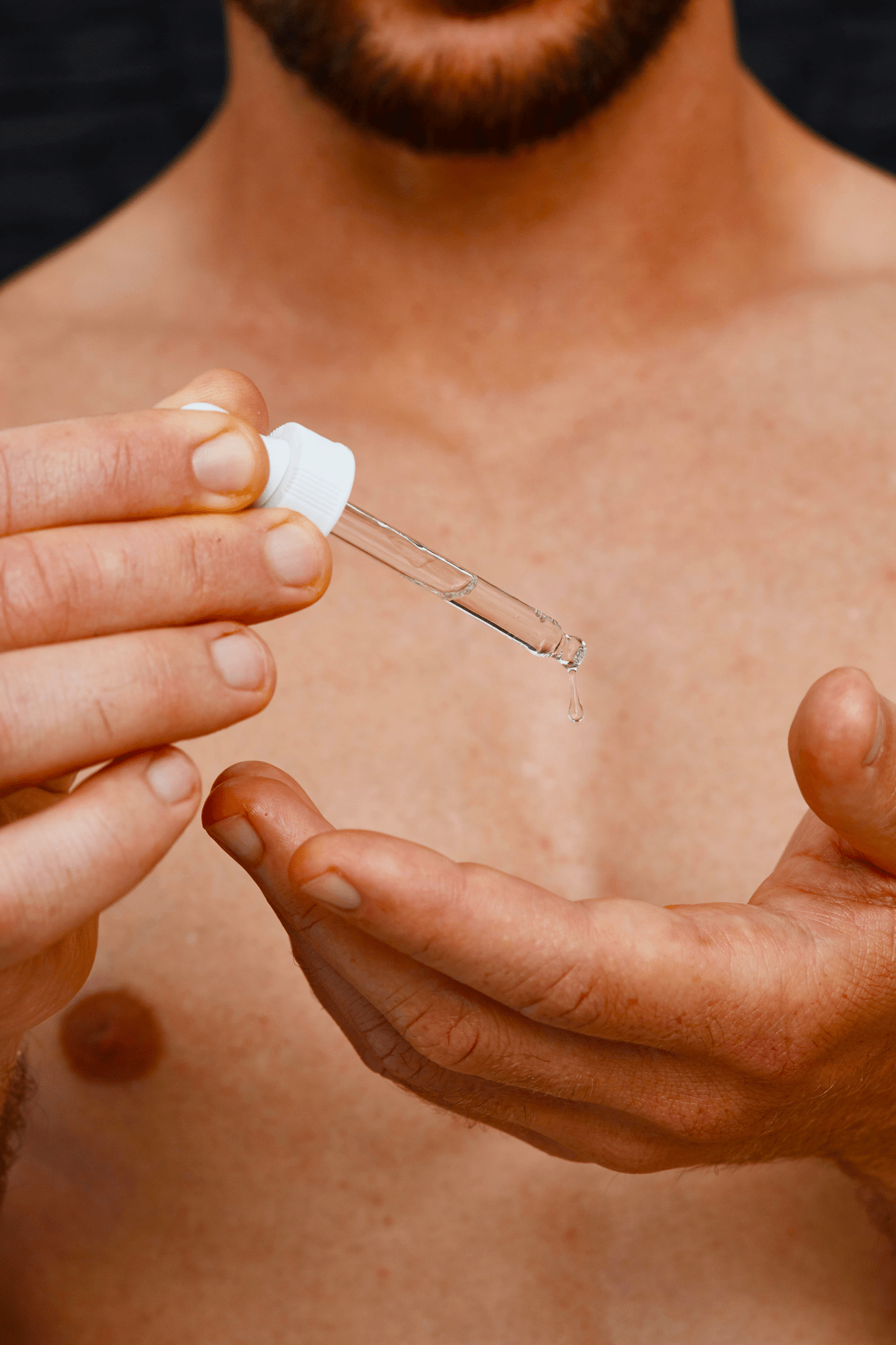 man holdling pipette